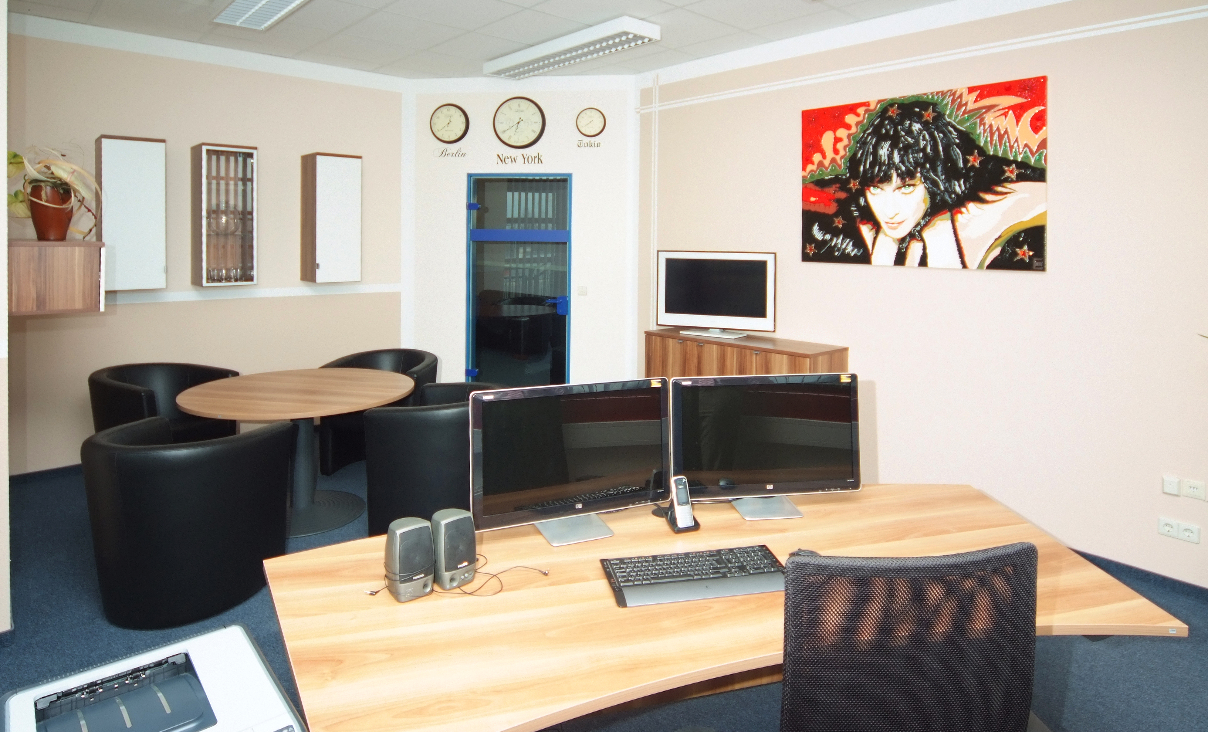 empty office with desk, chair and sitting area