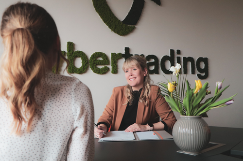 woman at her desk in a staff interview