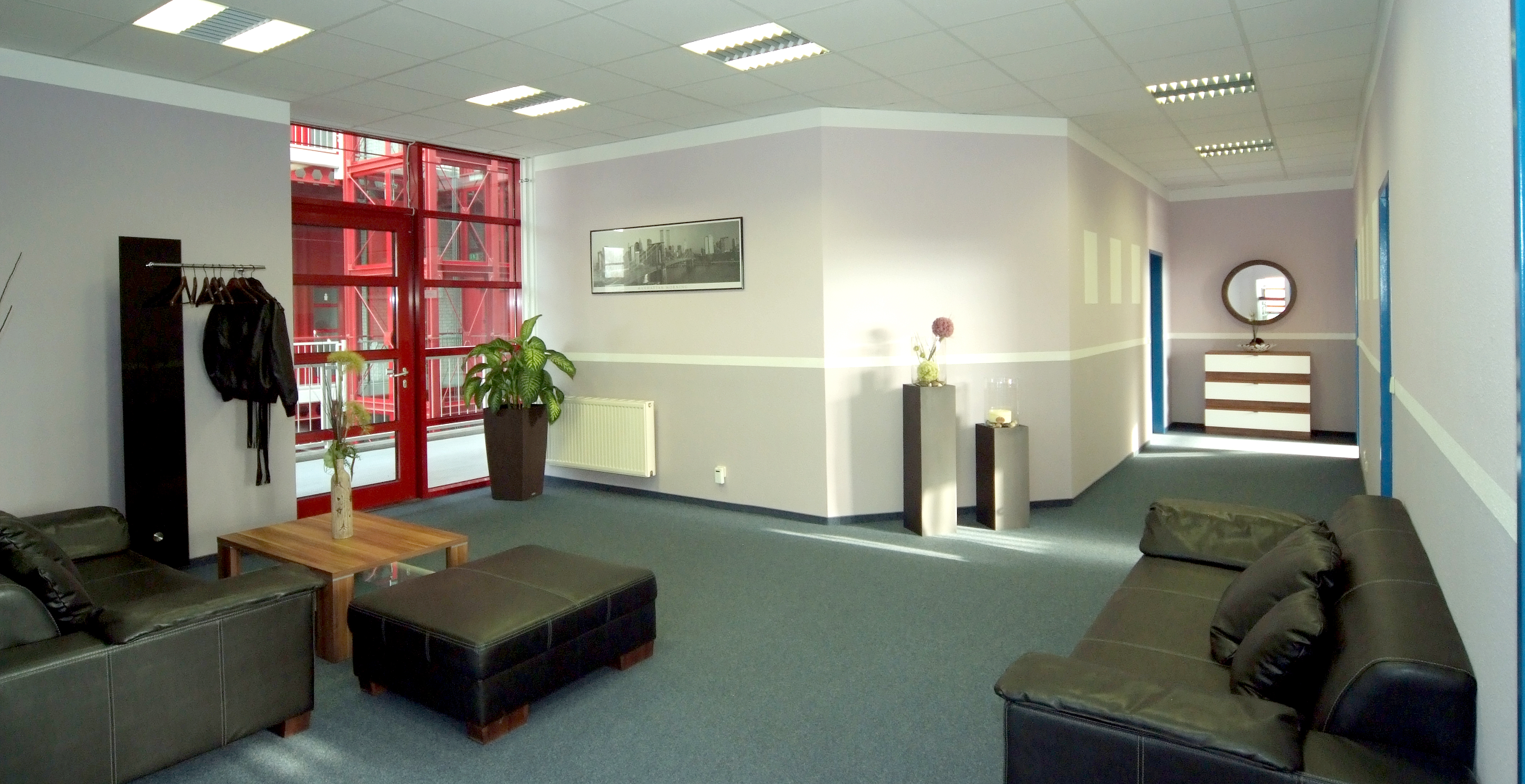 meeting area with couches and plants