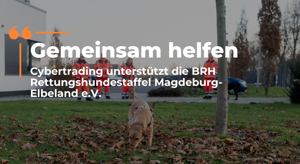 Team der Rettungshundestaffel mit ihren Hunden vor dem Cybertrading-Gebäude